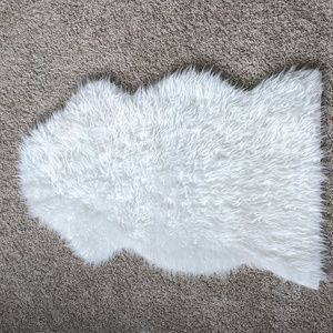 White fuzzy faux fur sheepskin throw or rug